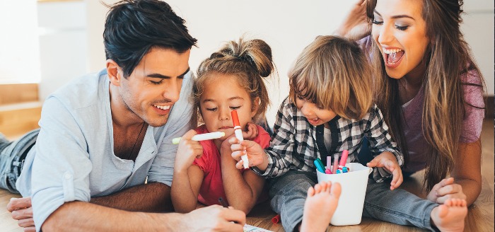 family of fours together father mother and two children painting