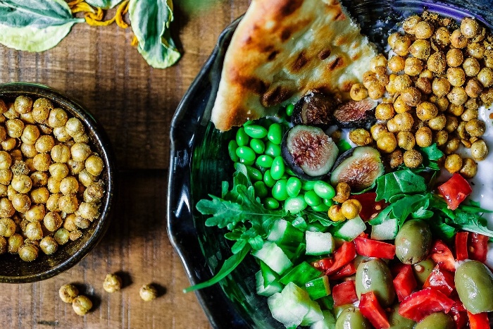 abundance of food large delicious salad and chickpeas on a table