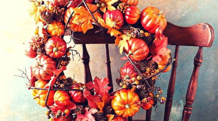 diy thanksgiving wreath fall themed wreath on the back of a chair 