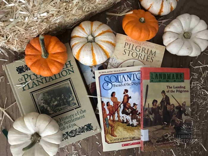 Pumpkins and old books and magazines hay stack the history of thanksgiving