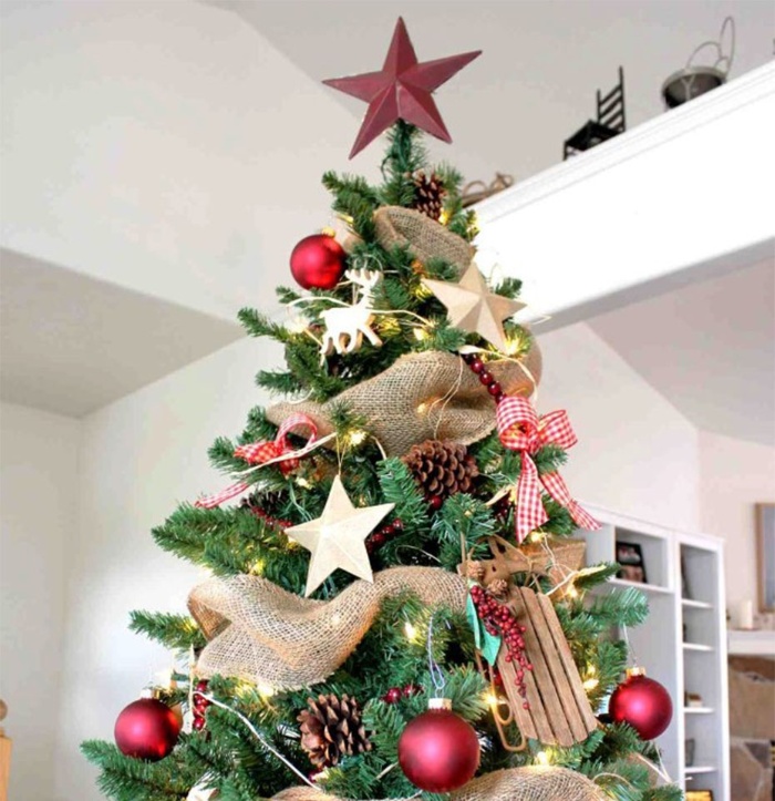 beautiful christmas tree decorated in red and white with a red star on top