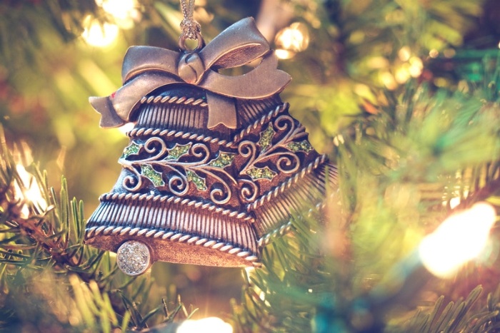 christmas bells ornament hanging on a tree