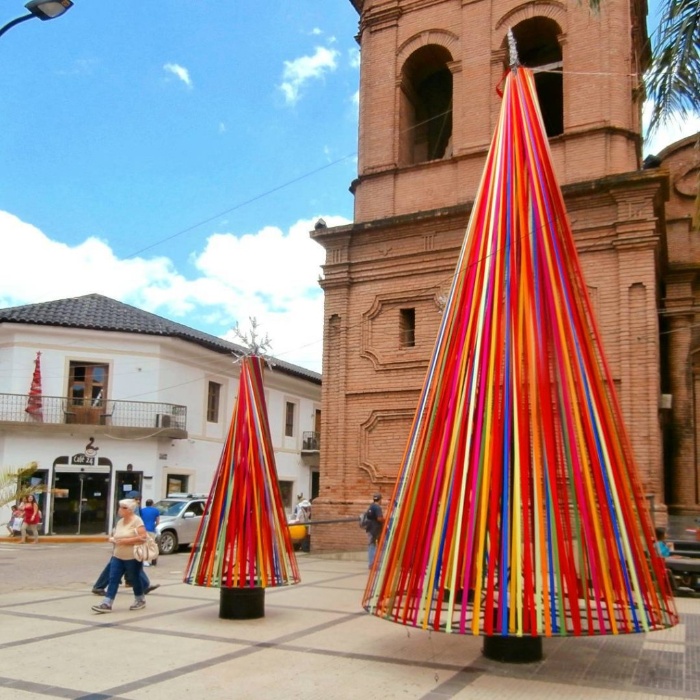 Colorful christmas trees on a square in Bolivia made of ribbons