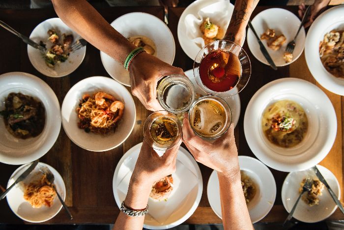 celebrating the holidays with good food and toast friends toasting with wine