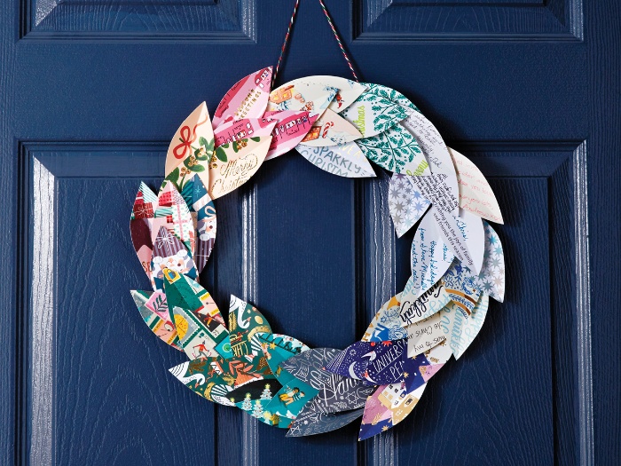 christmas cards wreath DIY hanging on a dark blue door