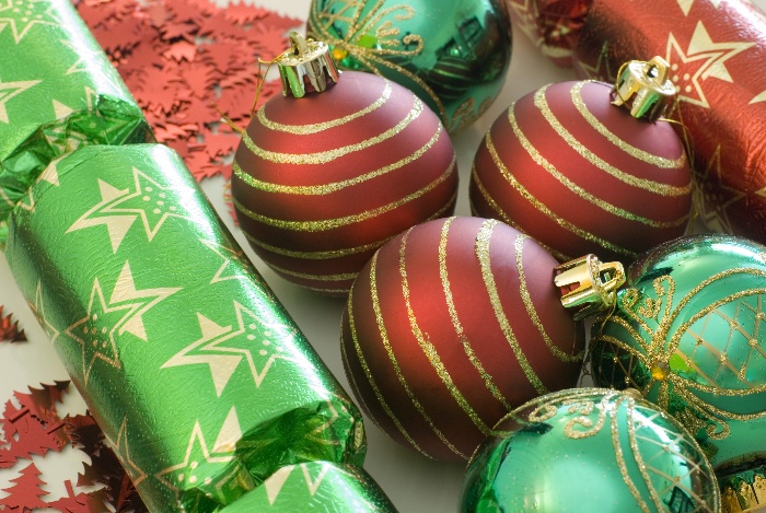 christmas decor in red and green baubles and confetti stick