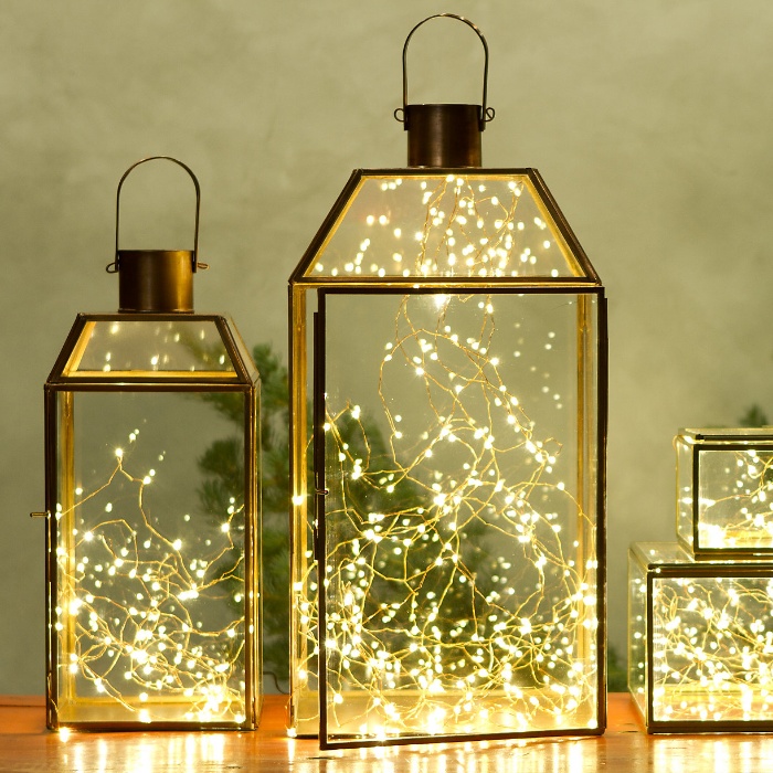 christmas lights metal and glass lanterns filled with fairy lights