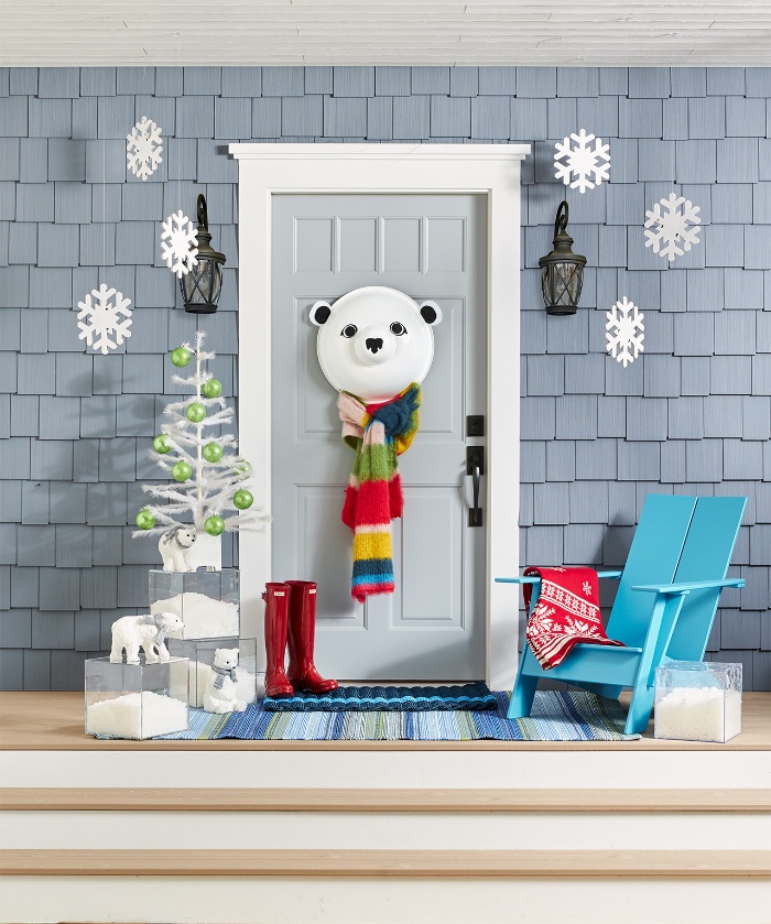 light blue door decorated with a bear red boots snowflakes