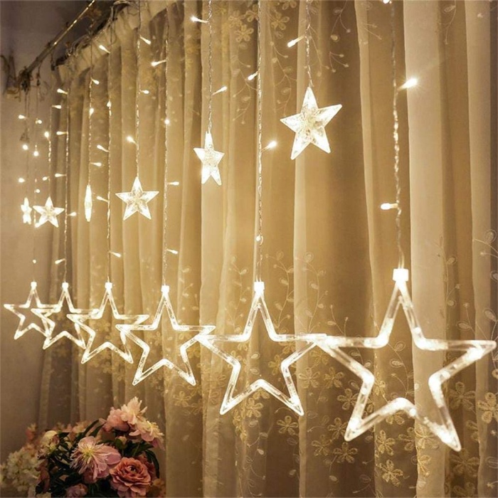 fairy star lights handing on the curtains two sets of stars