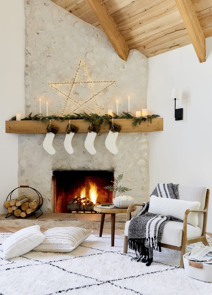 beautiful white scandinavian style fireplace white stockings wooden furniture and roof pillows on the floor