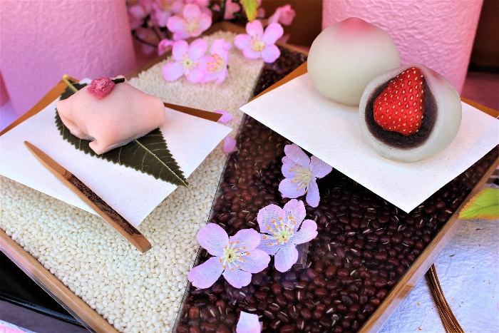 Japanese gift set with mochi and sweet brown beans and sakura flowers