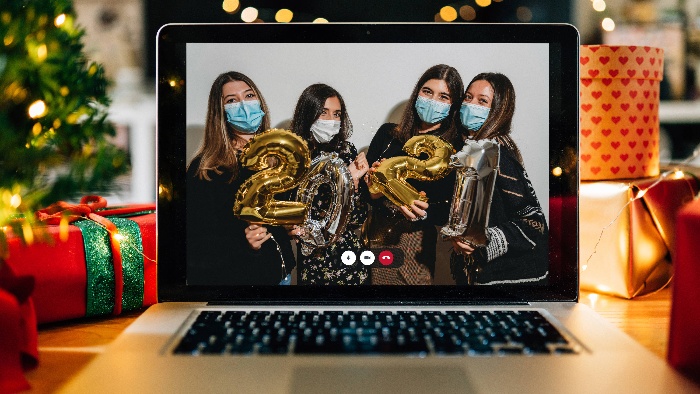 new year's eve party girls with masks on their faces holding balloons on a computer screen 