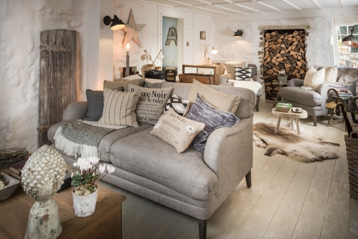 a room decorated in the holiday spirit decor in white gray and wood