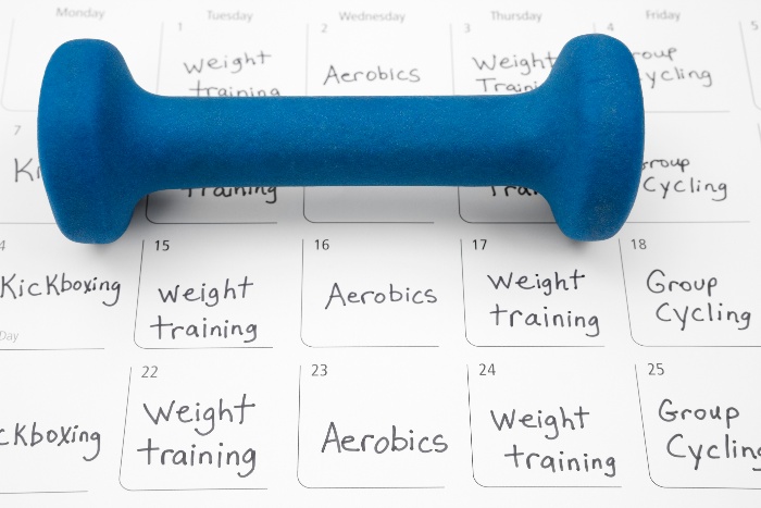 workout schedule stay active during the holidays calendar planning with a blue weigh