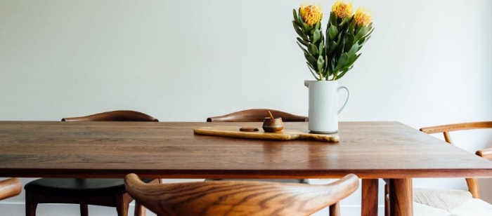 design elements wooden table with yellow flowers in a white vase