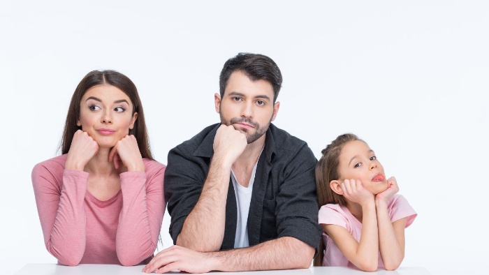 family woman man and girl on a white background