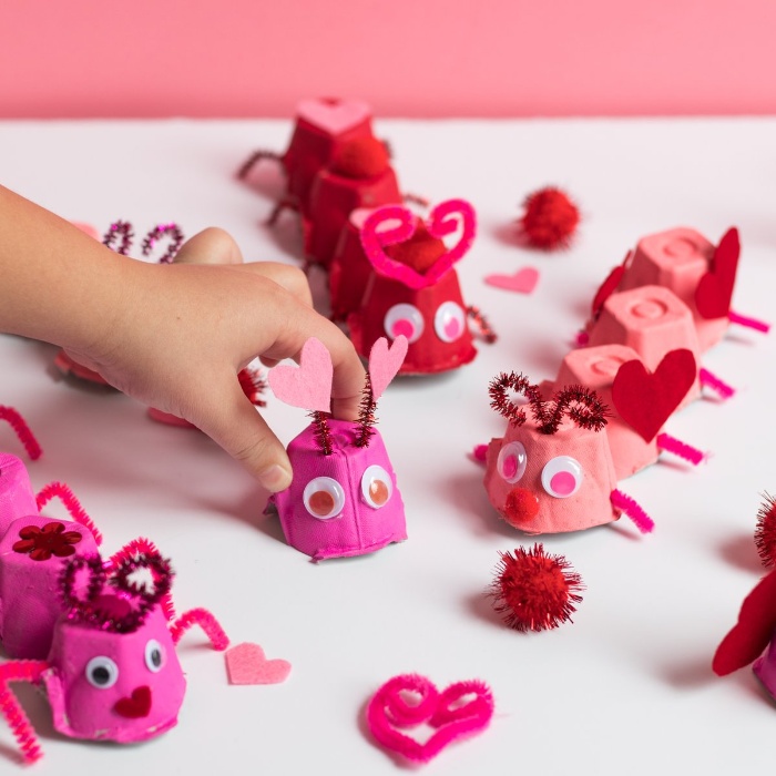 love bugs made of pink paper and hearts