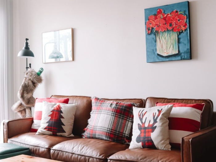 seasonal winter textures in an interior pillows with winter motifs on a couch