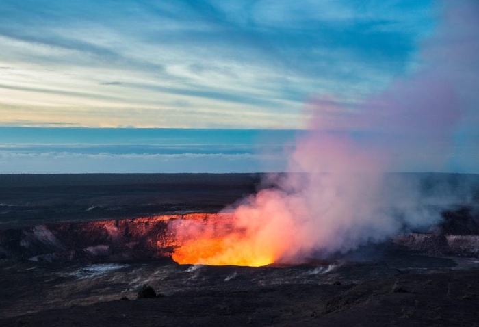 National park of Hawaii volcano errupting hot red lava flames and smoke