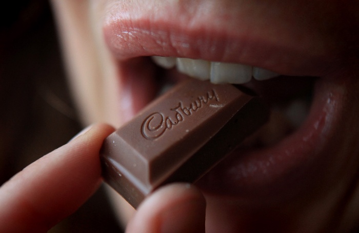 lips close up eating a chocolate block 