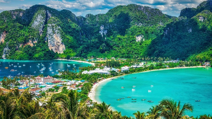 ko phi phi island and small town tropical green white beaches and mountains