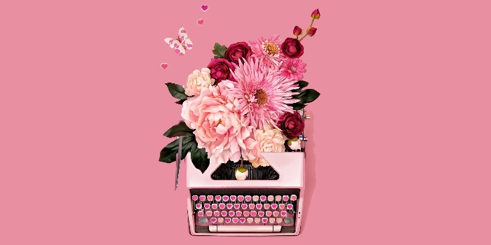 love languages pink retro typewriter decorated with flowers on a pink background