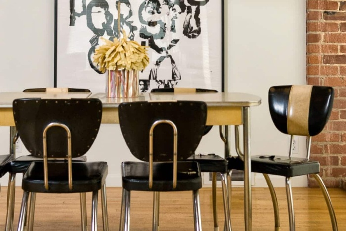 retro dining room with vintage black chairs and golden elements