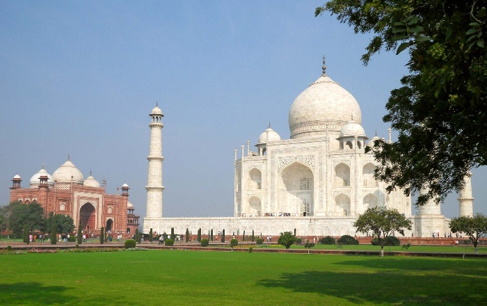 virtually visiting the taj mahal captured from afar with green grass in front