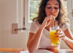 woman drinking a juice