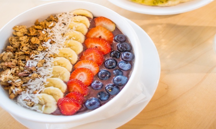 vegetarian easter breakfast acai bowl with different fruits and nuts