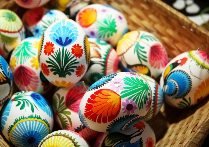 blown out eggs decorated with different colors and motifs