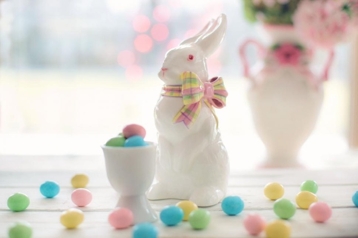 porcelain easter bunny with colorful candy around