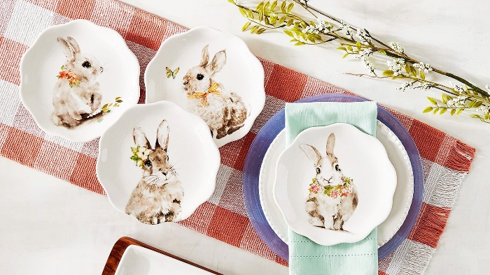 cute easter table decor with a table runner and plates with rabbits