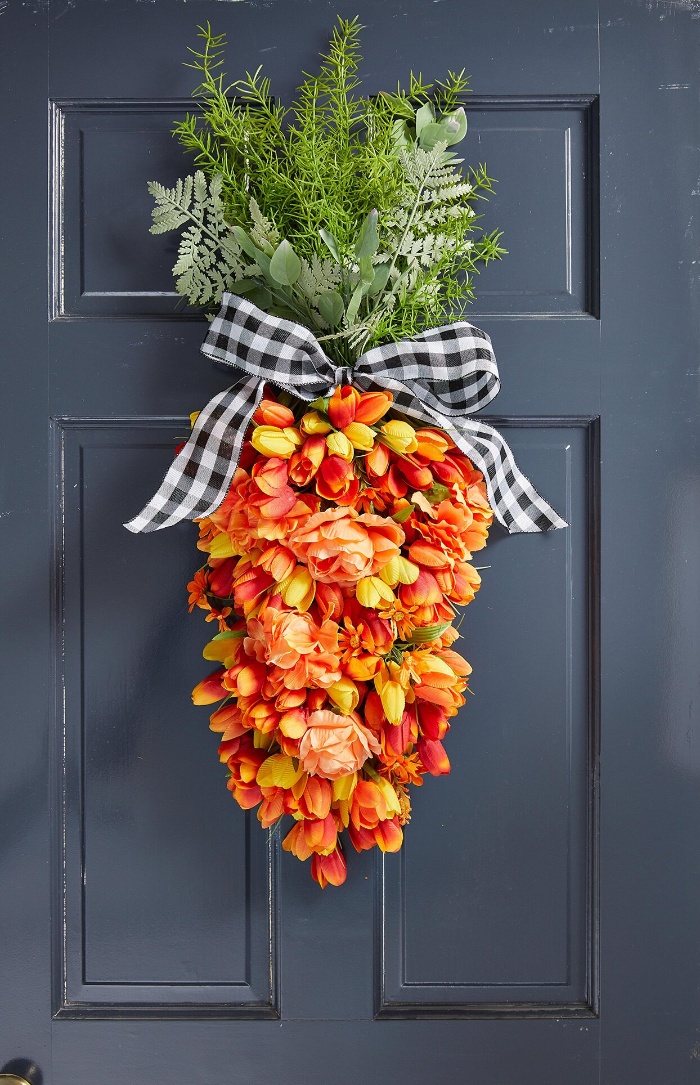 easter door decor carrot shaped wreath with a ribbon