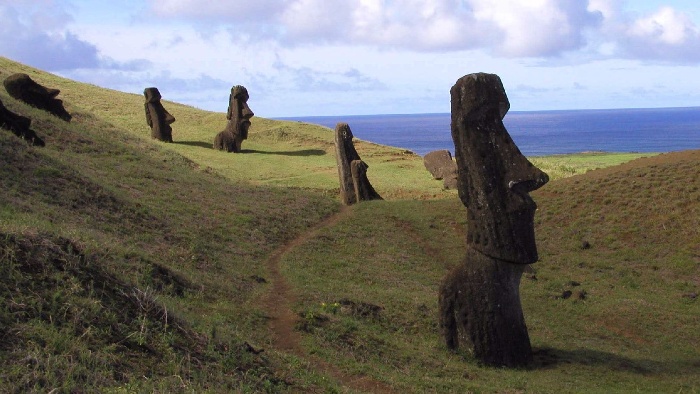 easter islands figures stone statues scattered around the hills of the island