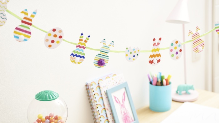 fun and colorful easter garland with bunny cut outs and eggs