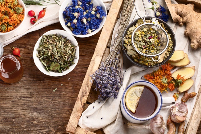 herbs scattered on a table lavender and other flowers