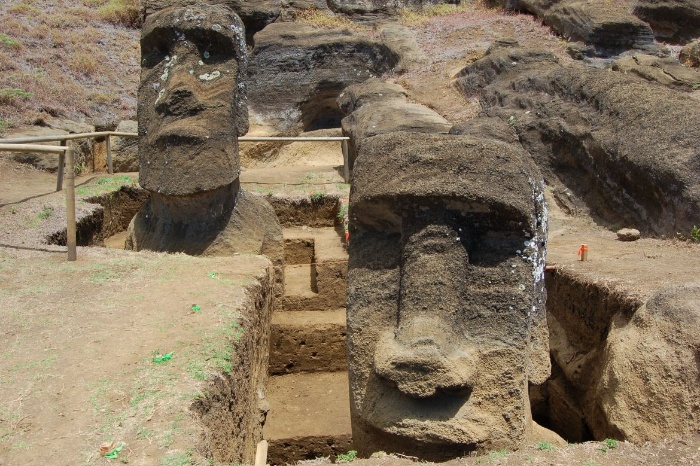 stone figures on the easter islands showing from the ground