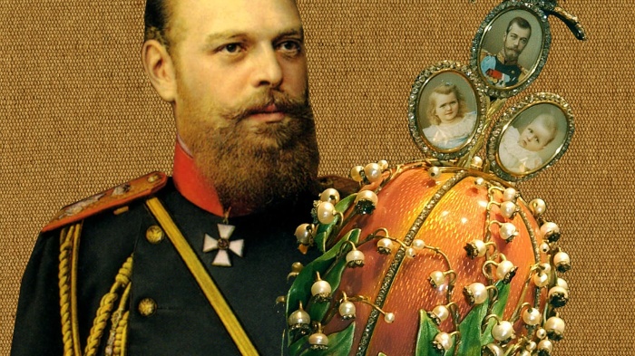 The russian tsar and a faberge egg with the photos of children and lilly of the valley decorations