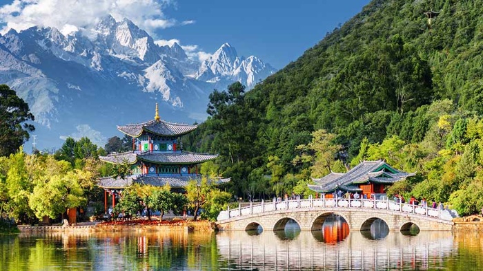 picture yunnan china mountains temple bridge and greenery lake