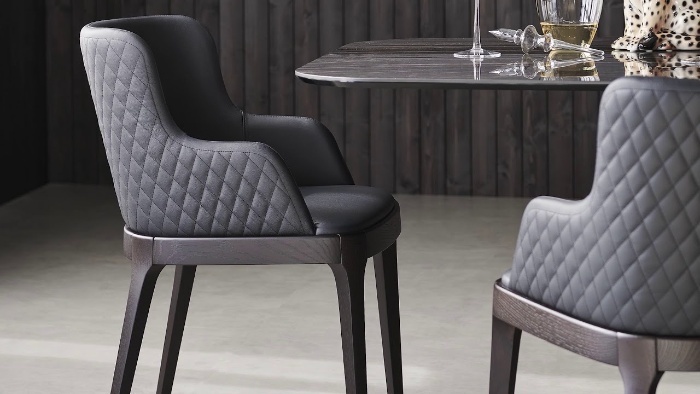 designer chair in metal gray glass table in a modern dining room