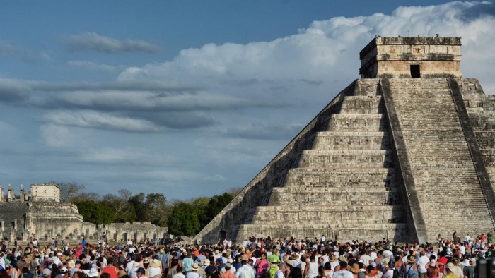 mexico people gathered in front of a pyramid welcoming spring celebration