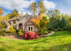 Panorama of suburban home on a sunny autumn afternoon