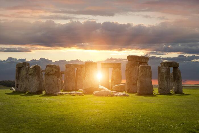 celebrating the summer solstice at Stonehendge the summer appearing between the stones