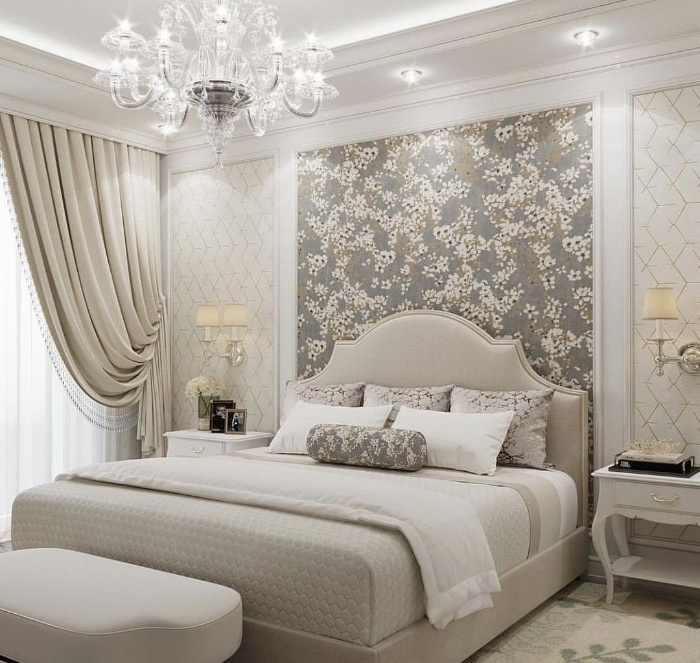 beautiful chandelier in a romantic bedroom with floral wallpaper