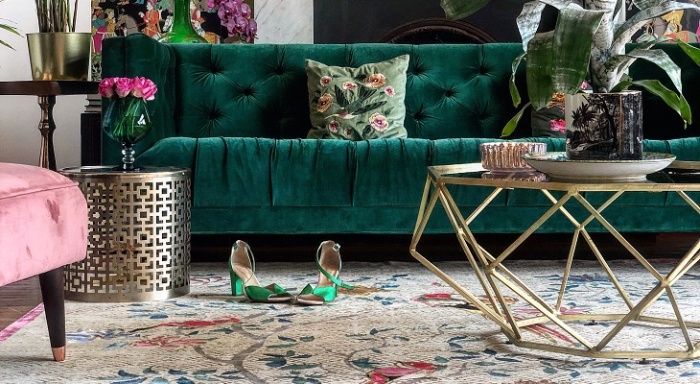 decorative interior in golden and dark green with floral statement pieces