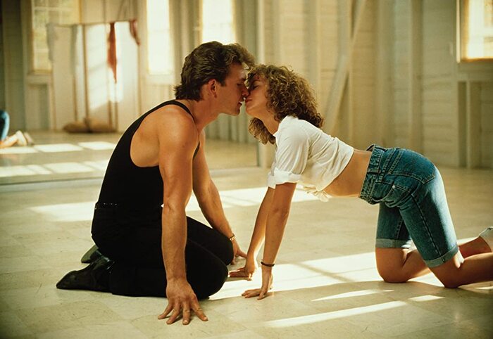 dirty dancing movie couple on the dance floor kneeling and kissing