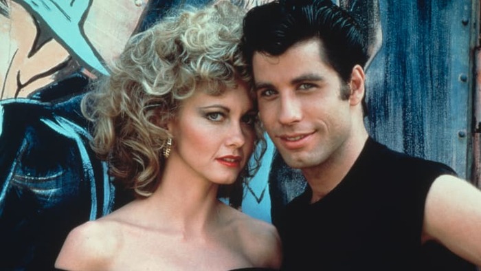 grease movie leading actors close up photo