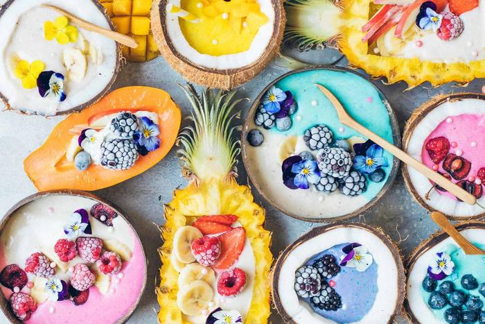 food trends rainbow food fruits filled with cream and flowers 