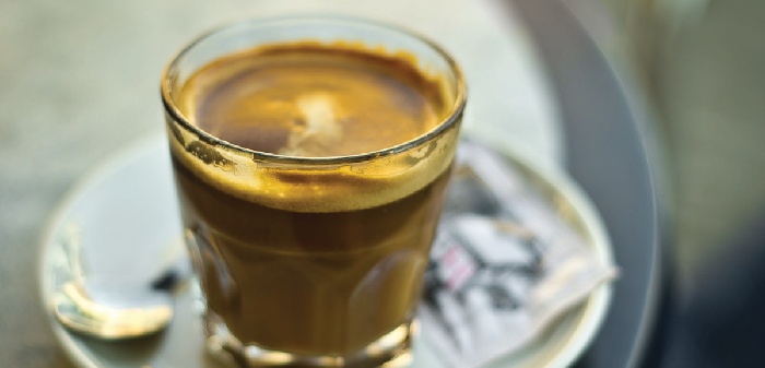 spanish cortado coffee in a glass on a table